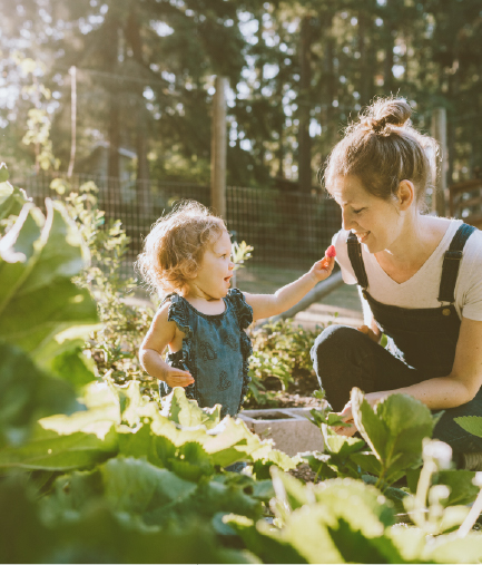mother and daughter playing in garden